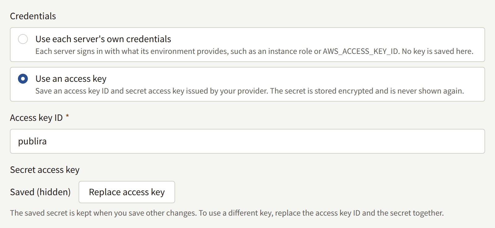 Storage's Credentials with an access key saved: the Access key ID, and the secret shown as Saved (hidden) with Replace access key.